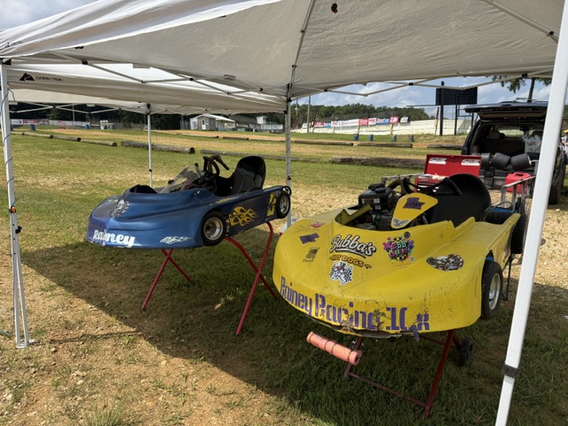 The blue 3 and yellow 10X up on their stands under the team canopy