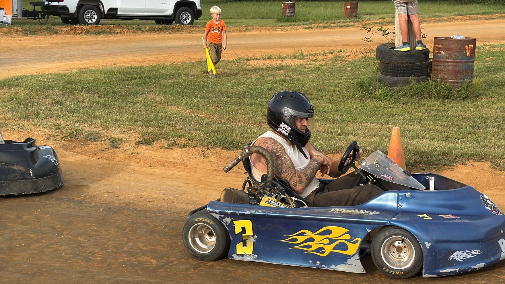 Ronnie's blue 3 kart racing on the Camden Speedway dirt