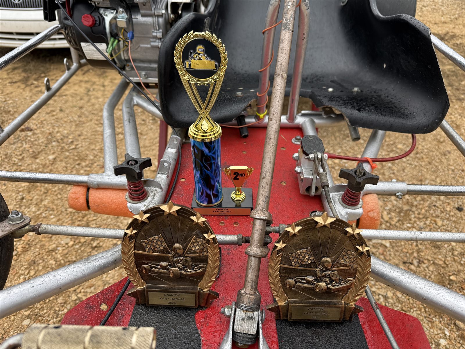 Close-up of Camden Kart Racing 2025 trophies on the kart