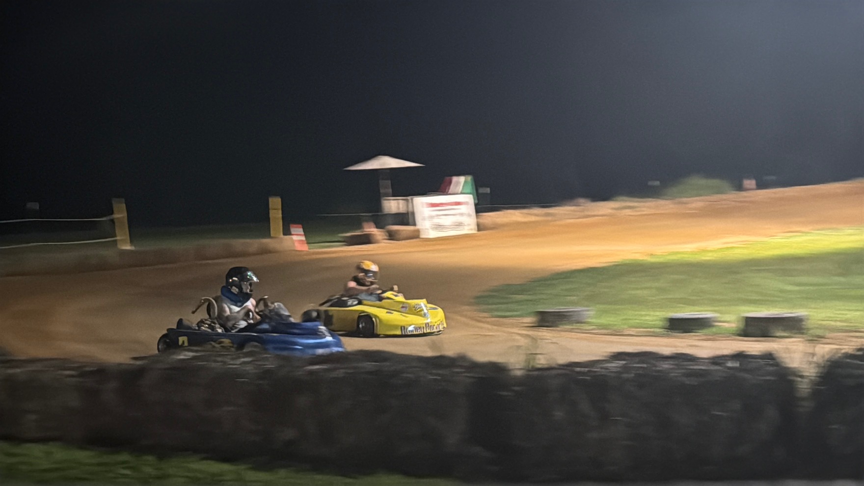 The 10X and the 3 racing side by side at night at Adjoining Hearts Raceway