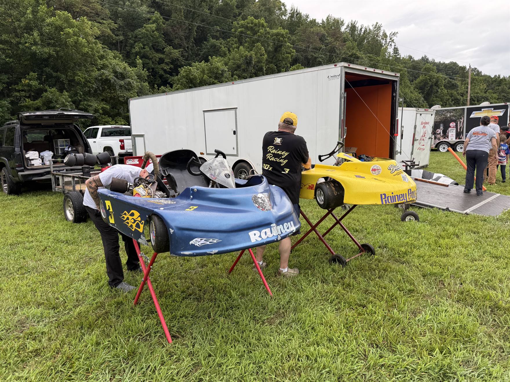The Rainey Racing team setting up in the pits at Sleepy Hollow Speedway beside the trailers