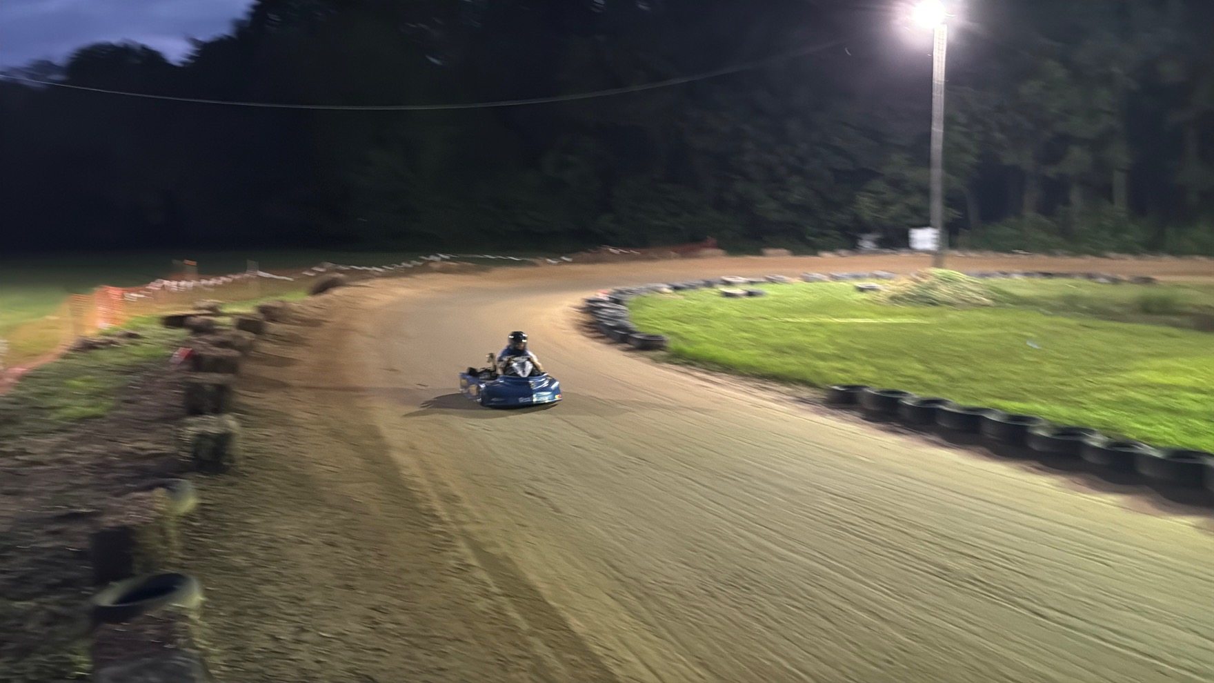 Ronnie's blue 3 coming through the corner under the light pole at Sleepy Hollow Speedway