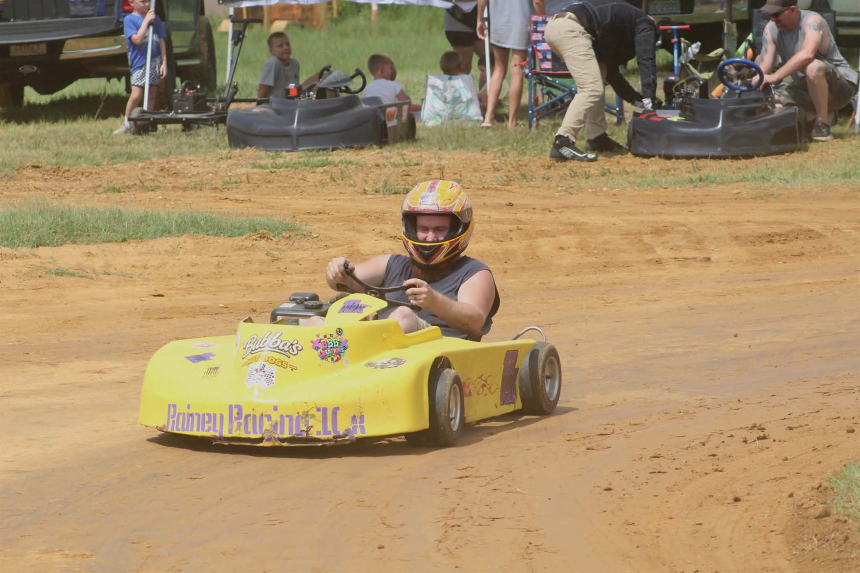 The 10X on track at Camden Speedway with the pits and families in the background
