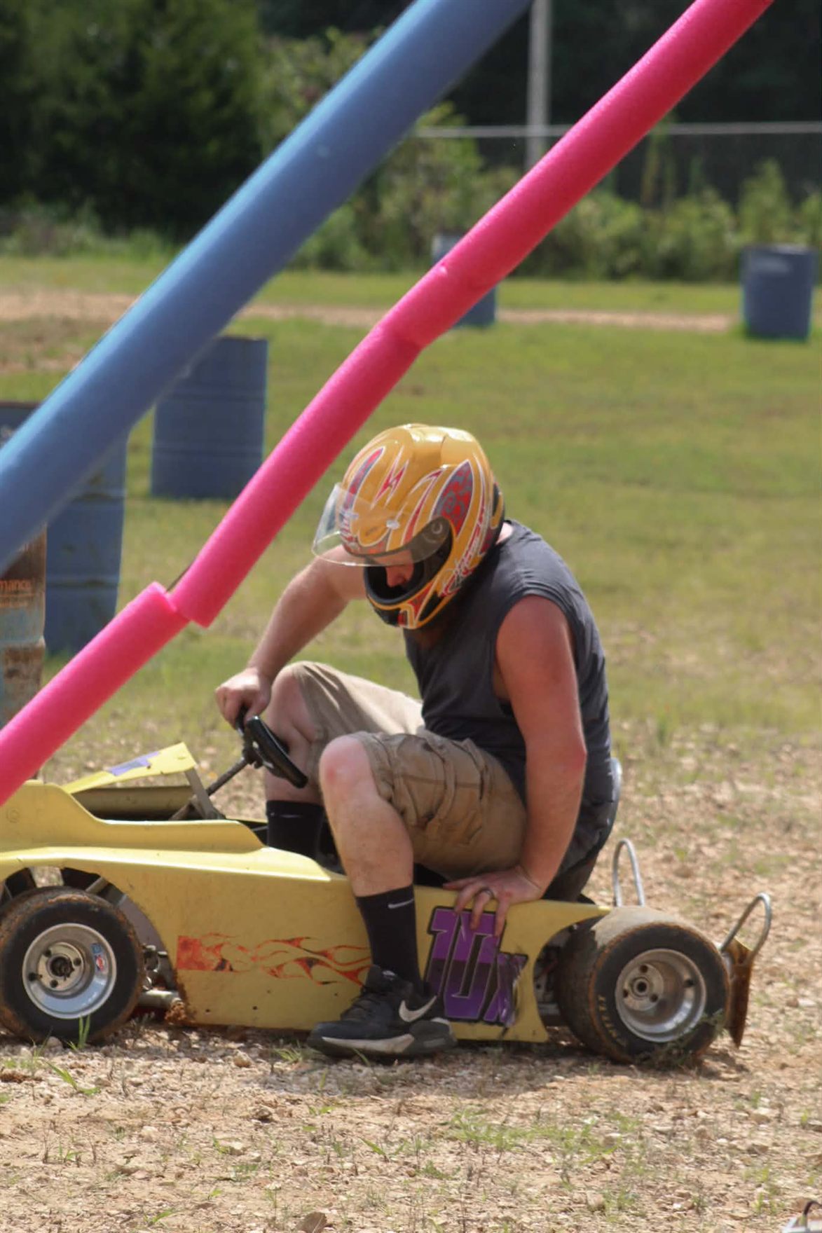 Travis in the seat of the 10X in his yellow helmet waiting to roll out at Camden Speedway